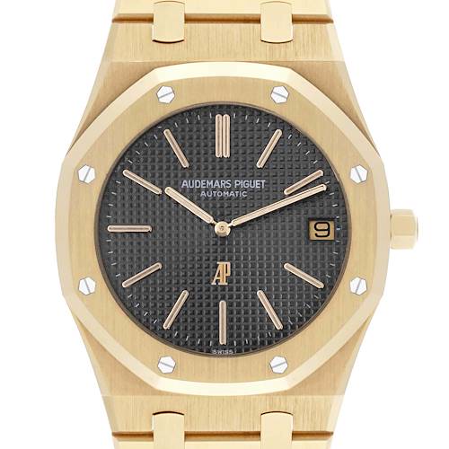 The Audemars Piguet Royal Oak 5402BA-001 Men's Yellow Gold Grey Dial 5402BA-001 Men's Yellow Gold Grey Dial watch is shown from a front angle, displaying its octagonal bezel, black dial, and date feature.