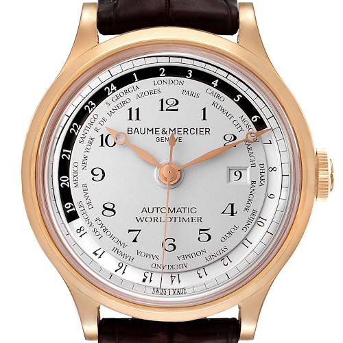 The image shows a frontal view of the Baume & Mercier Capeland M0A10107 Men's Rose Gold Silver Dial M0A10107 Men's Rose Gold Silver Dial Worldtimer watch face and part of the strap.