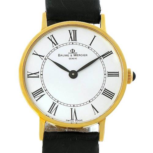 This image shows a Baume & Mercier Classima 55121 Men's Yellow Gold White Dial 55121 Men's Yellow Gold White Dial watch from the front, highlighting the dial, hands, Roman numerals, and leather strap.