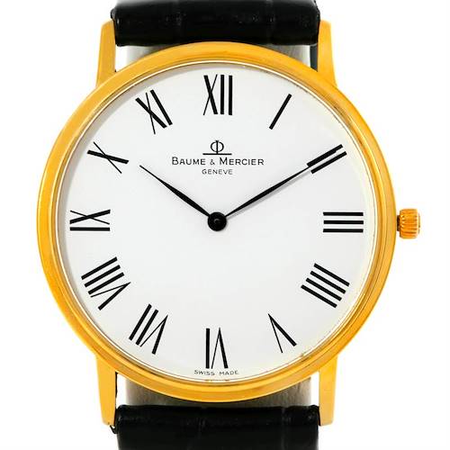 The Baume & Mercier Classima MV045088 Men's Yellow Gold White Dial MV045088 Men's Yellow Gold White Dial watch is shown from the front, displaying the face, Roman numerals, hands, and part of the strap.