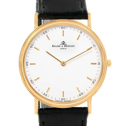 The image shows a Baume & Mercier Classima 15603 Men's Yellow Gold White Dial 15603 Men's Yellow Gold White Dial watch from a front angle, highlighting its white dial, gold case, and black leather strap.