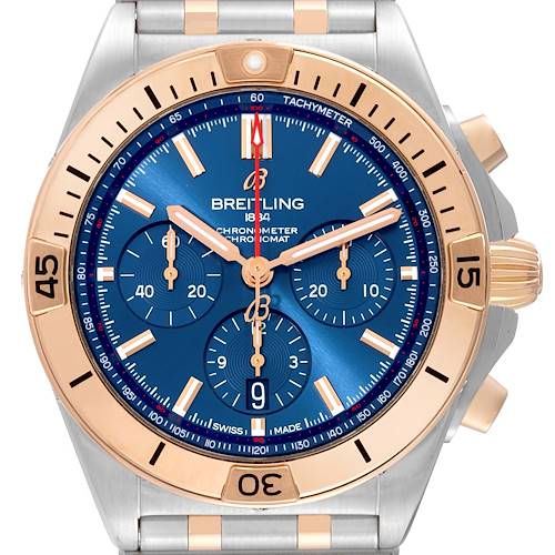 The image shows a frontal view of a Breitling Chronomat UB0134101C1U1 Men's Steel and Gold (two tone) Blue Dial UB0134101C1U1 Men's Steel and Gold (two tone) Blue Dial watch, highlighting its face, bezel, and a portion of the bracelet.