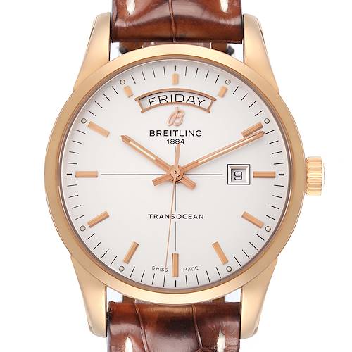 The Breitling Transocean R45310 Men's Rose Gold Silver Dial watch is shown from a front angle, highlighting its dial, hands, date window, and leather strap.