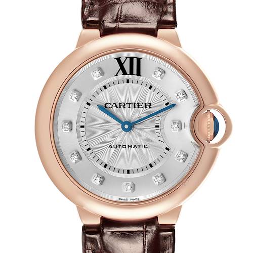 The Cartier Ballon Bleu WJBB0010 Women's Rose Gold Silver Dial watch is shown from the front, highlighting the dial, blue hands, Roman numerals, and crown.
