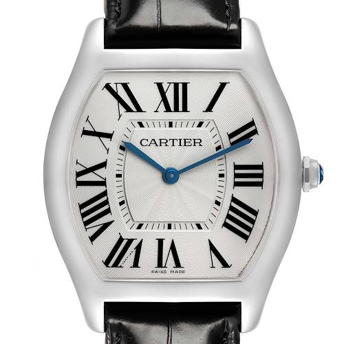 The Cartier Tortue WGTO0003 Men's White Gold Silver Dial watch is shown from the front, highlighting its dial, Roman numerals, blued hands, and crown with a cabochon.