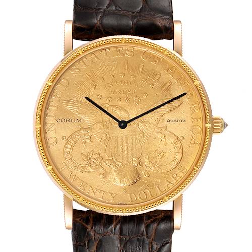 The image shows a front view of the Corum Coin Watch  Men's Yellow Gold Black Dial  Men's Yellow Gold Black Dial model, highlighting its face, hands, bezel, and leather strap attachment.