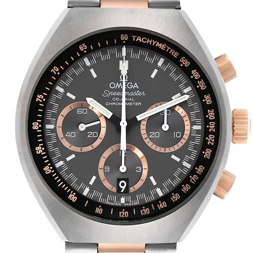 The Omega Speedmaster 327.20.43.50.01.001 Men's Steel and Gold (two tone) Grey Dial watch is shown from the front, highlighting the dial, subdials, bezel, and crown.