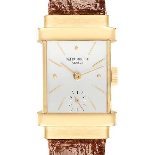 The image shows a front view of a Vintage Patek Philippe watch featuring a rectangular gold case, a white dial, and a leather strap.
