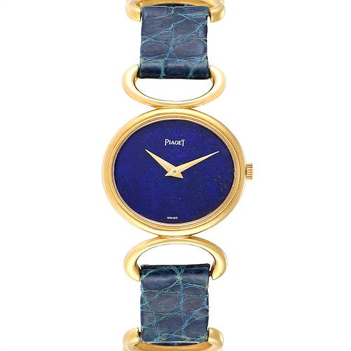 The image shows a Piaget 9451 Women's Yellow Gold Blue Dial 9451 Women's Yellow Gold Blue Dial Classique 9451 model watch with a yellow gold case and lapis dial, including parts of the blue strap.