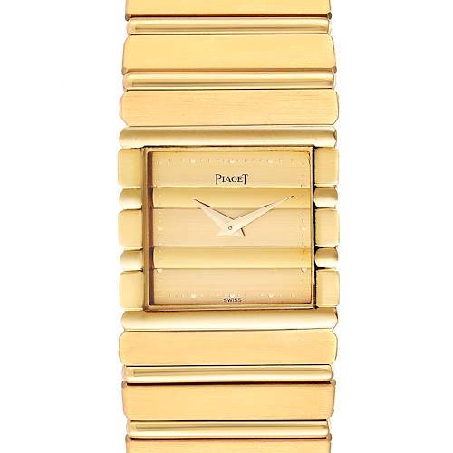 The image shows a close-up of the Piaget 7131 C 701 Men's Yellow Gold Champagne Dial 7131 C 701 Men's Yellow Gold Champagne Dial Polo 18K Yellow Gold Men's Watch 7131, highlighting its face and part of the bracelet.