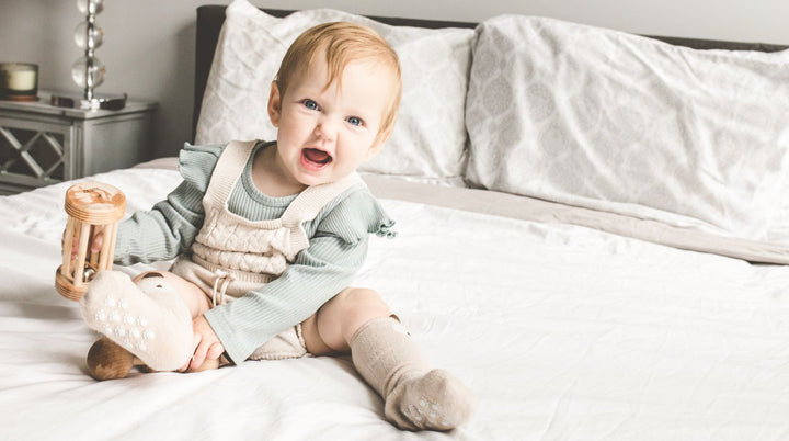 Baby smiling with 2 bottom teeth